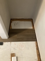 Covering up Greta Artwork with Flooring 1